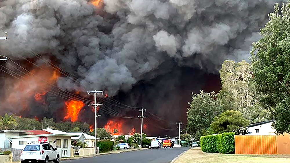 Bushfires threaten the township of Harrington in November 2019