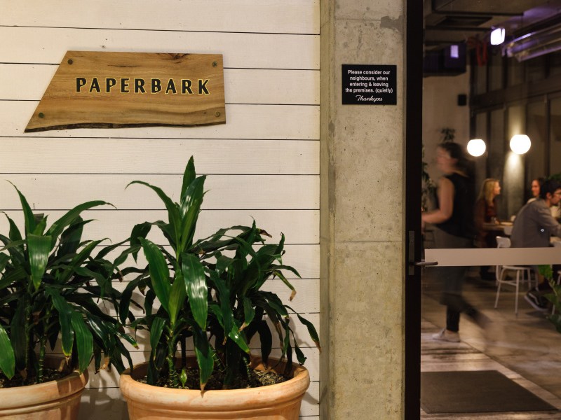 Restaurant entrance with sign reading Paperbark